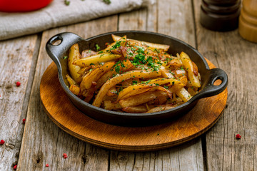 Fried potatoes with mushrooms