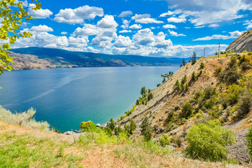 Beautiful view on Okanagan lake and mountains from the shore