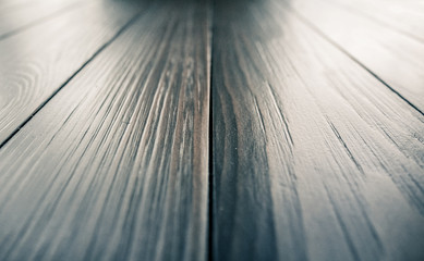 Empty brown wooden table in focus and blurred bokeh background