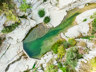 Papingo Rock Pools, also called ovires, natural green water pools located in small smooth-walled gorge near the village of Papingo in Zagori region, Greece.