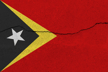 East Timor flag on concrete wall with crack
