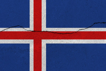 Fototapeta premium Iceland flag on concrete wall with crack