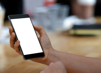 Female hand holding a smartphone blank screen,close-up shoot.