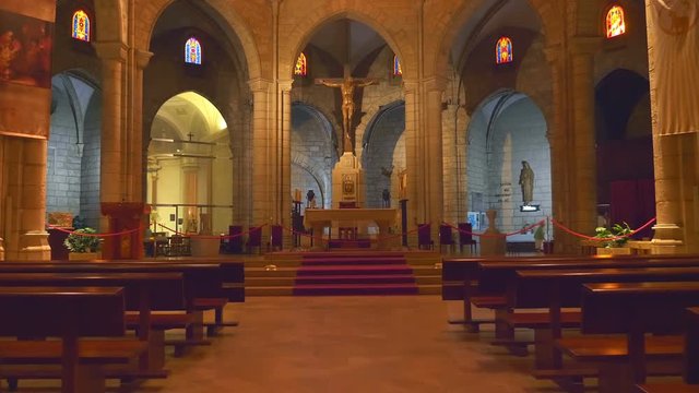 In the Spain inside the ancient church affects the design and richness of decoration and  antique national artifacts - icons, statues of Saints, pictures and art paintings. Shot in motion