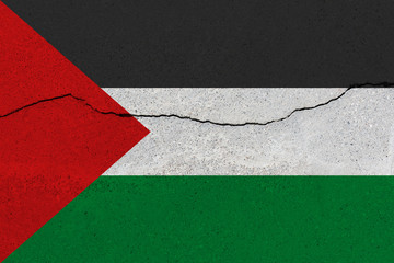 palestine flag on concrete wall with crack
