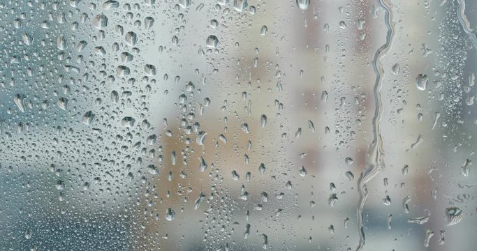 Water droplets on glass, rain outside