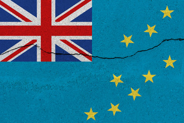 Tuvalu flag on concrete wall with crack