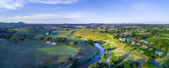 Aerial panorama of Yass River meandering through beautiful countryside at sunset. Yass, New South Wales, Australia