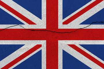 Fototapeta premium United Kingdom flag on concrete wall with crack