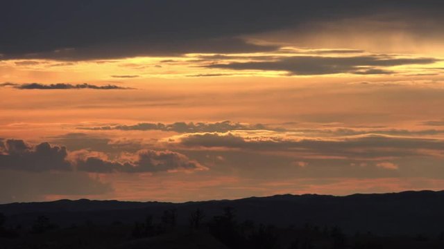 Time-laps video of sunset over mongolian sand desert Altan Els