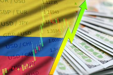 Colombia flag and chart growing US dollar position with a fan of dollar bills