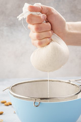 Homemade nut milk making process. Step by step recipe.