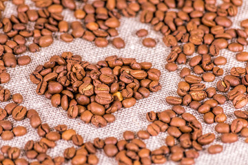 Coffee beans and a valentine symbol. Concept: loving coffee.