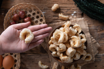 Pork rinds also known as chicharon or chicharrones , kab moo