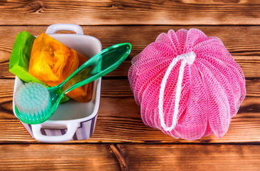 Objects for care of skin: handmade natural soap, sponge, the peeling brush