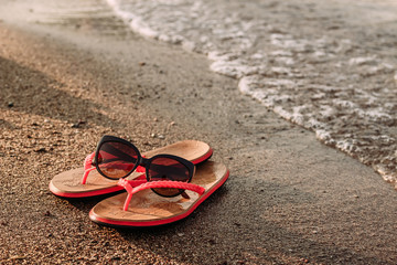 red women's beach flip-flops for the sand on the beach