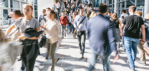 blurred business people at a trade fair