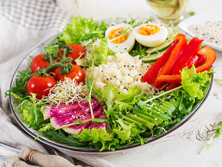 Couscous, egg and vegetables bowl. Healthy, diet, vegetarian food concept.  Vegetarian buddha bowl.