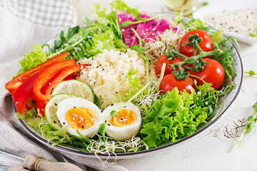 Couscous, egg and vegetables bowl. Healthy, diet, vegetarian food concept.  Vegetarian buddha bowl.