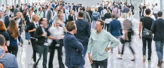 Crowd of people walking street