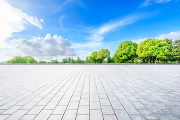 Empty square floor and green woods in nature park