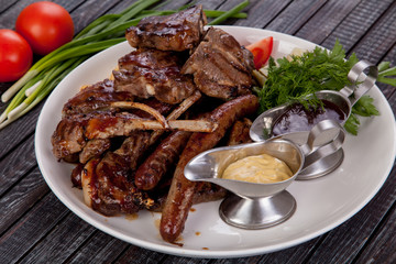 juicy and appetizing steak tamogavok of horse meat on the table, for design in cooking	