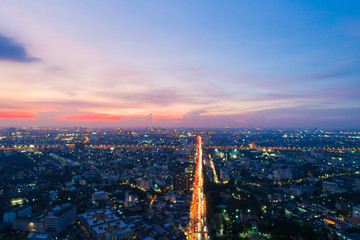 Aerial view sunset in Bangkok city building with city transport road