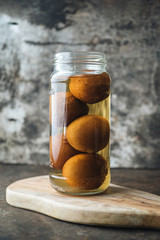 Pickled lemon on rustic background