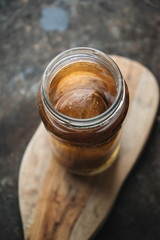 Pickled lemon on rustic background