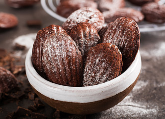 Chocolate cookies. Homemade Chocolate Madeleines on dark table. French cuisine.