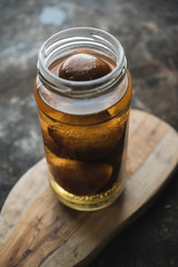 Pickled lemon on rustic background