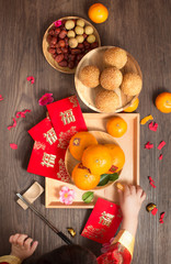 Flat lay Chinese new year food and drink still life image. Red envelope with 