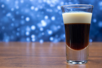 Coffee and milk liquor in a shot glass