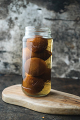 Pickled lemon on rustic background