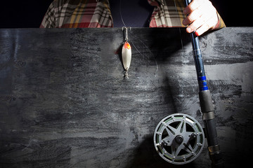 Men's hands with fishing tackle