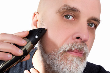 Man shaves his beard