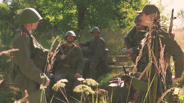 Soldiers talking and waiting in camp near frontline