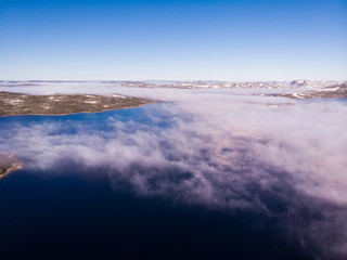 Fototapeta na wymiar Clouds over lake water, Hardangervidda landscape, Norway
