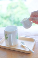hot cup with little jar