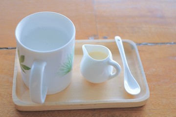 hot cup with little jar