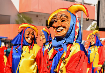 Carnival clothed people in mask by parade in Germany