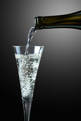 Champagne pouring into glass.