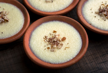 phirni - sweet rice pudding - traditional punjabi sweet dish in earthen plate