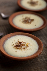 phirni - sweet rice pudding - traditional punjabi sweet dish in earthen plate