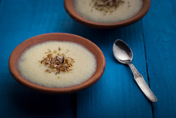 phirni - sweet rice pudding - traditional punjabi sweet dish in earthen plate
