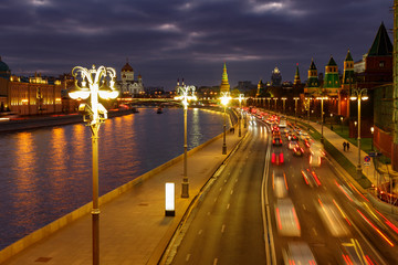 Fototapeta na wymiar Car traffic on Kremlevskaya embankment at night. Urban landscape