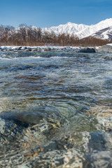 長野県白馬村 雪山と松川の雪景色