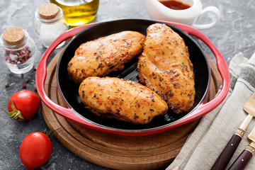 Grilled chicken breast.Grilled chicken breast or fillet on iron pan. 