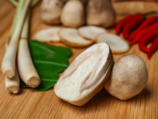 fresh mushrooms on a wooden cutting board