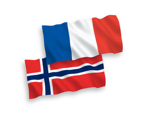 National vector fabric wave flags of France and Norway isolated on white background. 1 to 2 proportion.